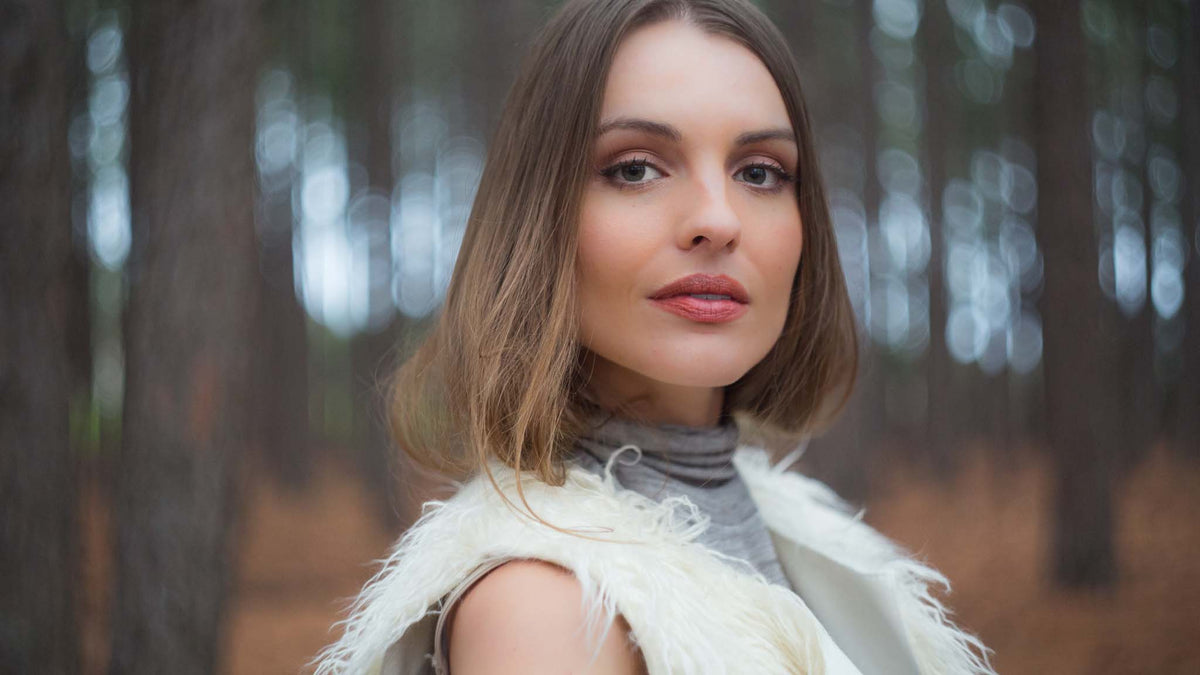 Portrait of a woman in a pine forest
